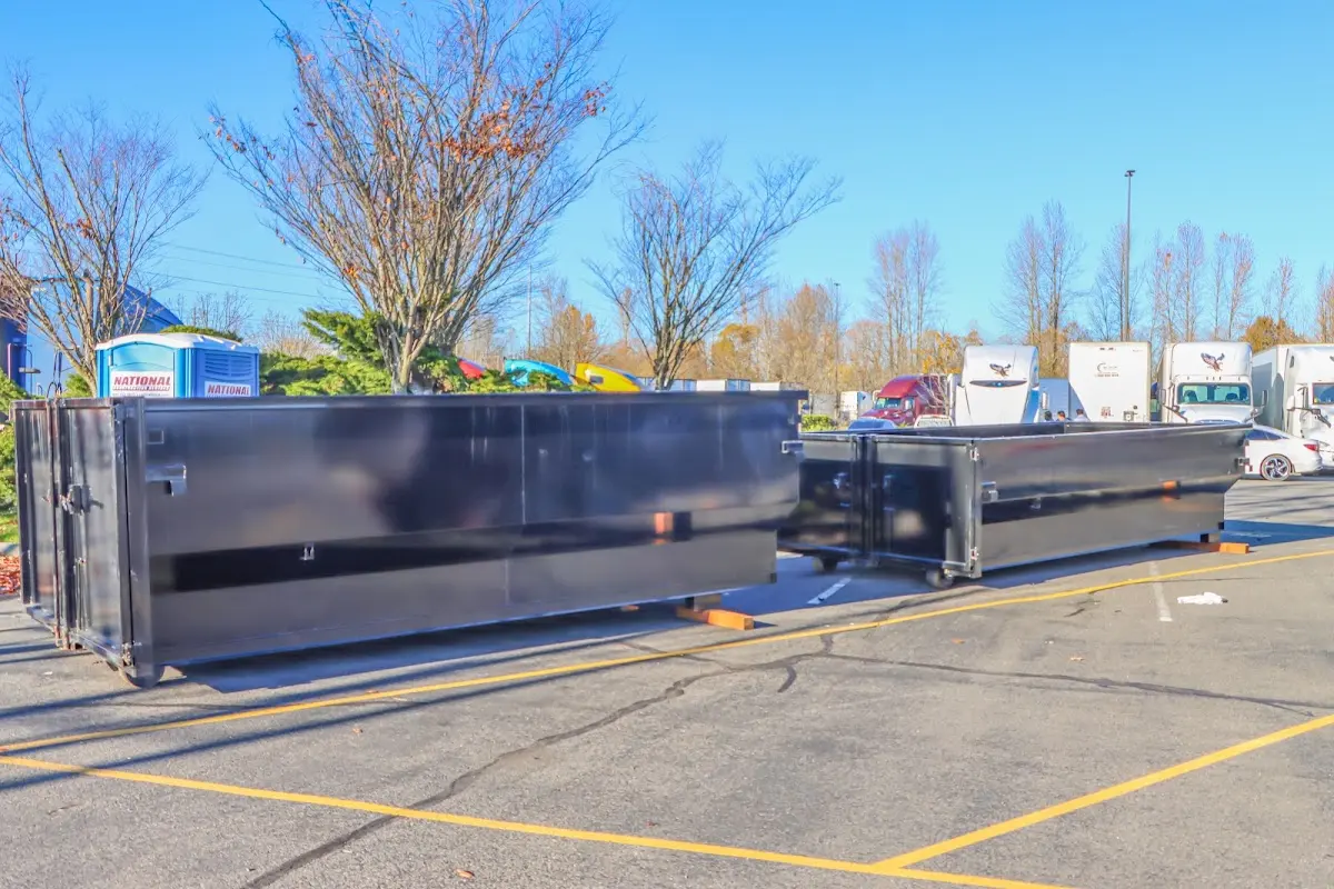 Professional dumpster rental service with roll-off container on residential driveway in Fruitridge Pocket